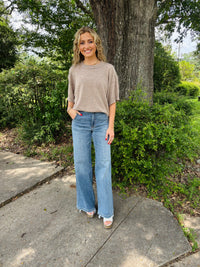 Drop shoulder comfy sweater top with raw edge detail.