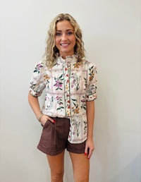 Floral print ruffle neck band collar button front closure top