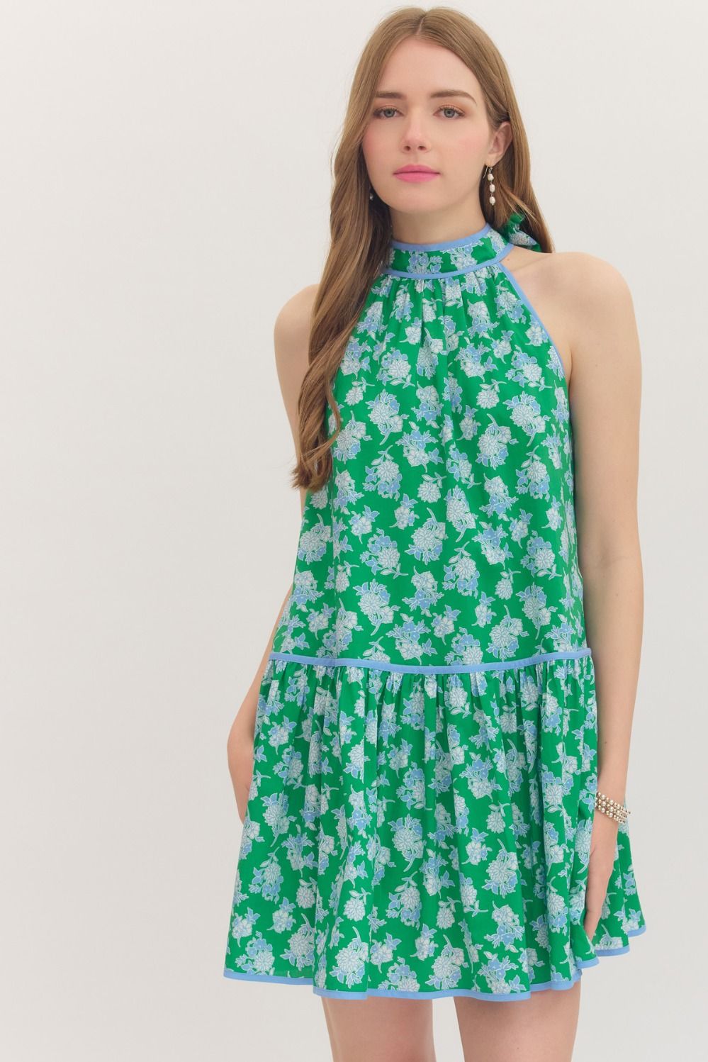 Floral print sleeveless mini dress featuring self-tie halter neckline