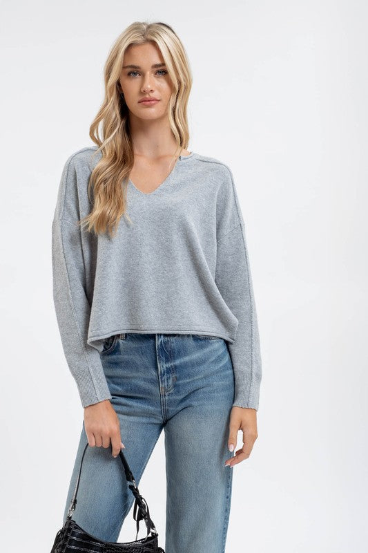 EXPOSED SEAM SPLIT NECK KNIT SWEATER