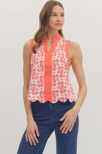 Printed sleeveless top featuring scallop hem detail.
