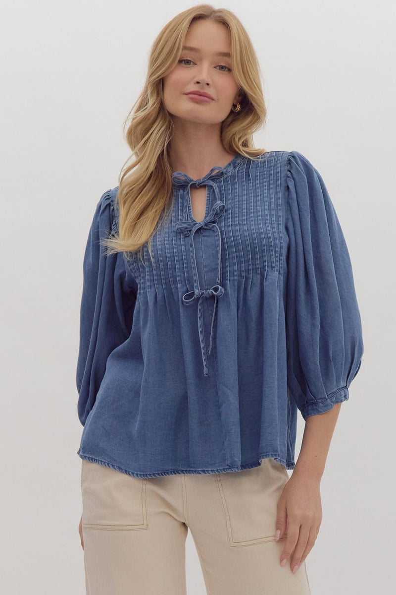 Denim ¾ puff sleeve pullover top featuring pintuck front panel