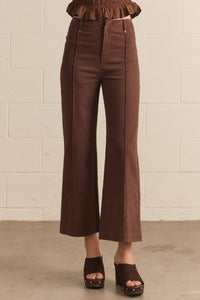 Solid high rise wide leg pants featuring front seam detail.