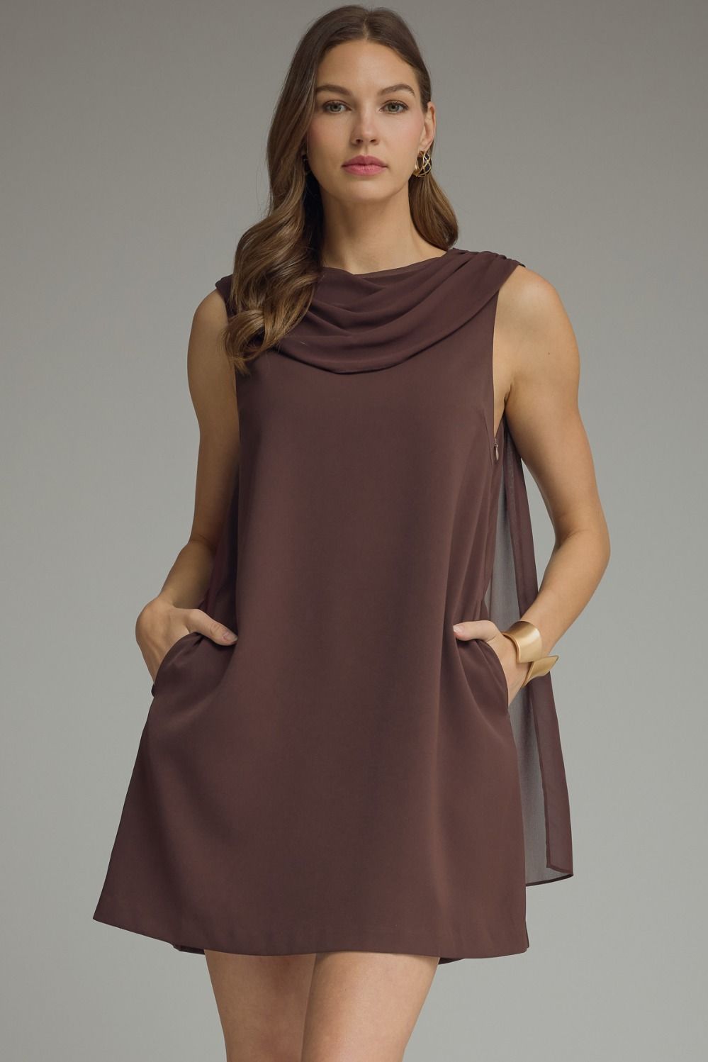 Solid sleeveless mini dress featuring draped cowl neckline with back scarf panel