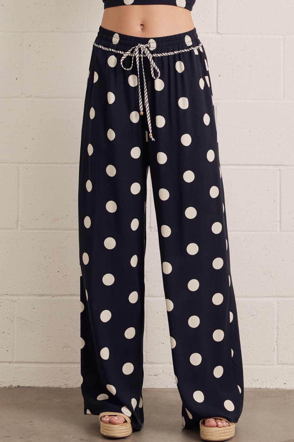 Polka dot wide leg pants featuring elasticated drawstring waistband