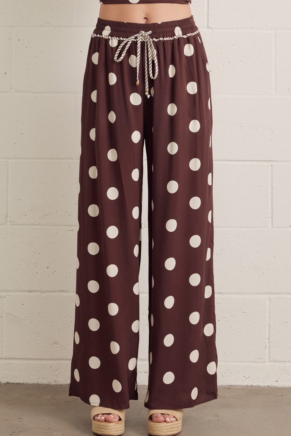 Polka dot wide leg pants featuring elasticated drawstring waistband