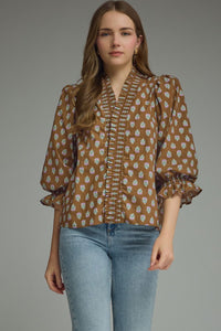 ¾ puff sleeve top featuring smocked V-neck detail
