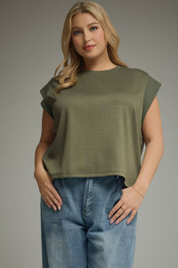 Solid round neck cap sleeve top featuring ribbed trim