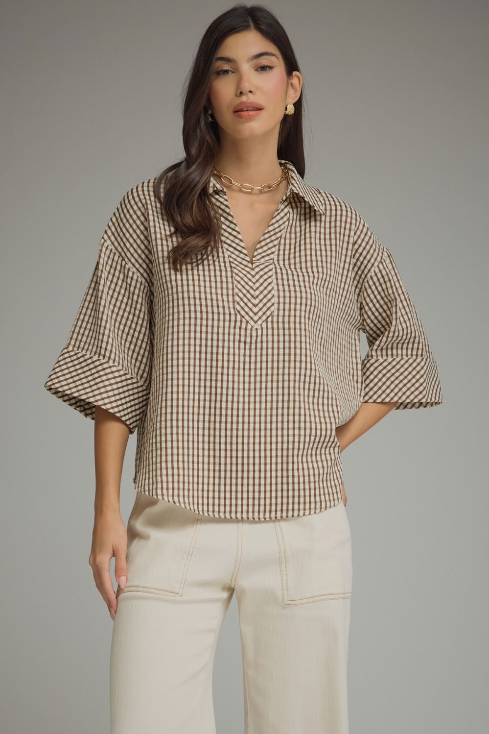 Gingham 3/4 sleeve top featuring V-neck collar detail