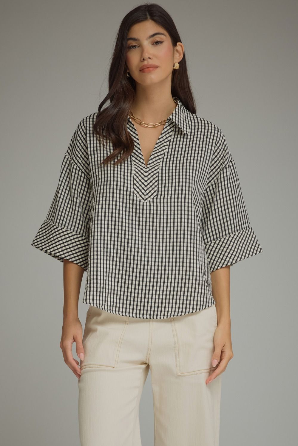 Gingham 3/4 sleeve top featuring V-neck collar detail