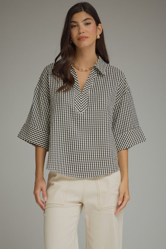 Gingham 3/4 sleeve top featuring V-neck collar detail