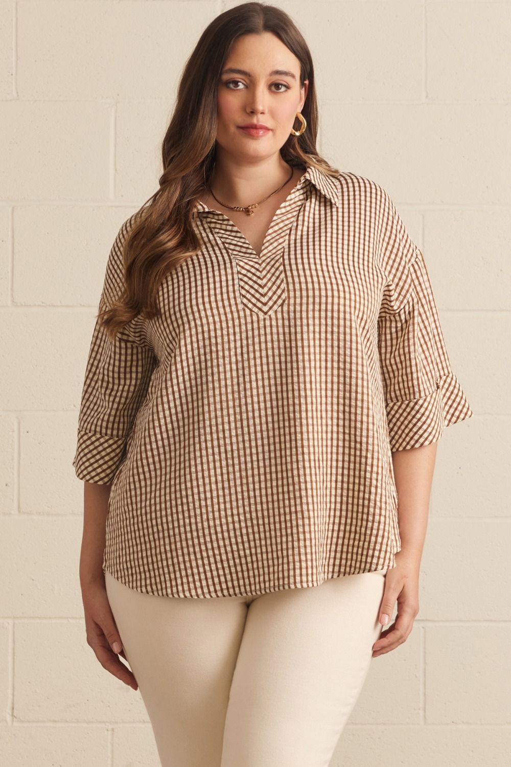 Gingham 3/4 sleeve top featuring V-neck collar detail