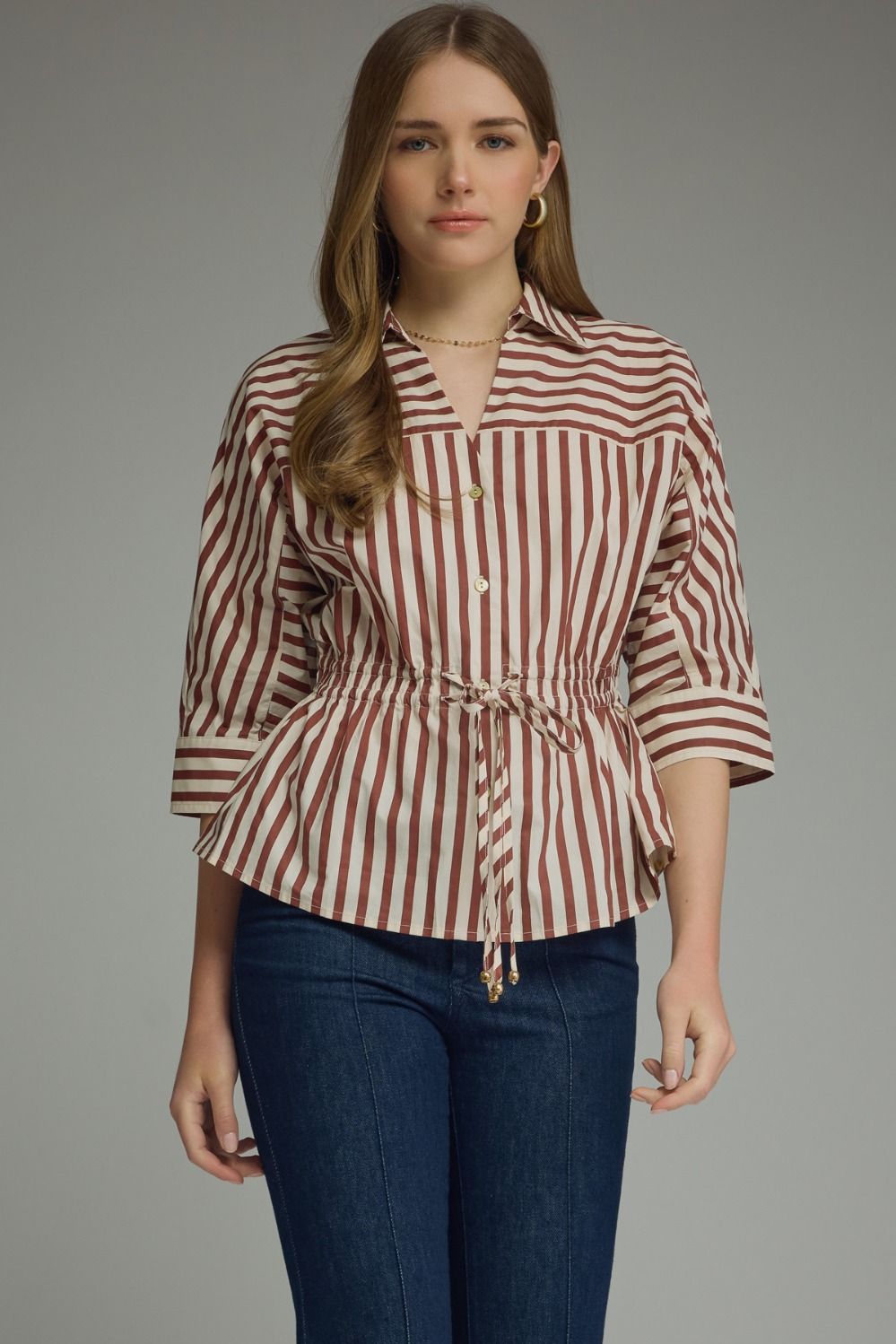 Stripe ¾ sleeve top featuring a V-neck