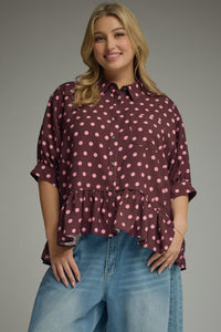 Polka dot short sleeve waist-length top featuring ruffle hem detail