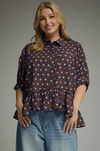 Polka dot short sleeve waist-length top featuring ruffle hem detail