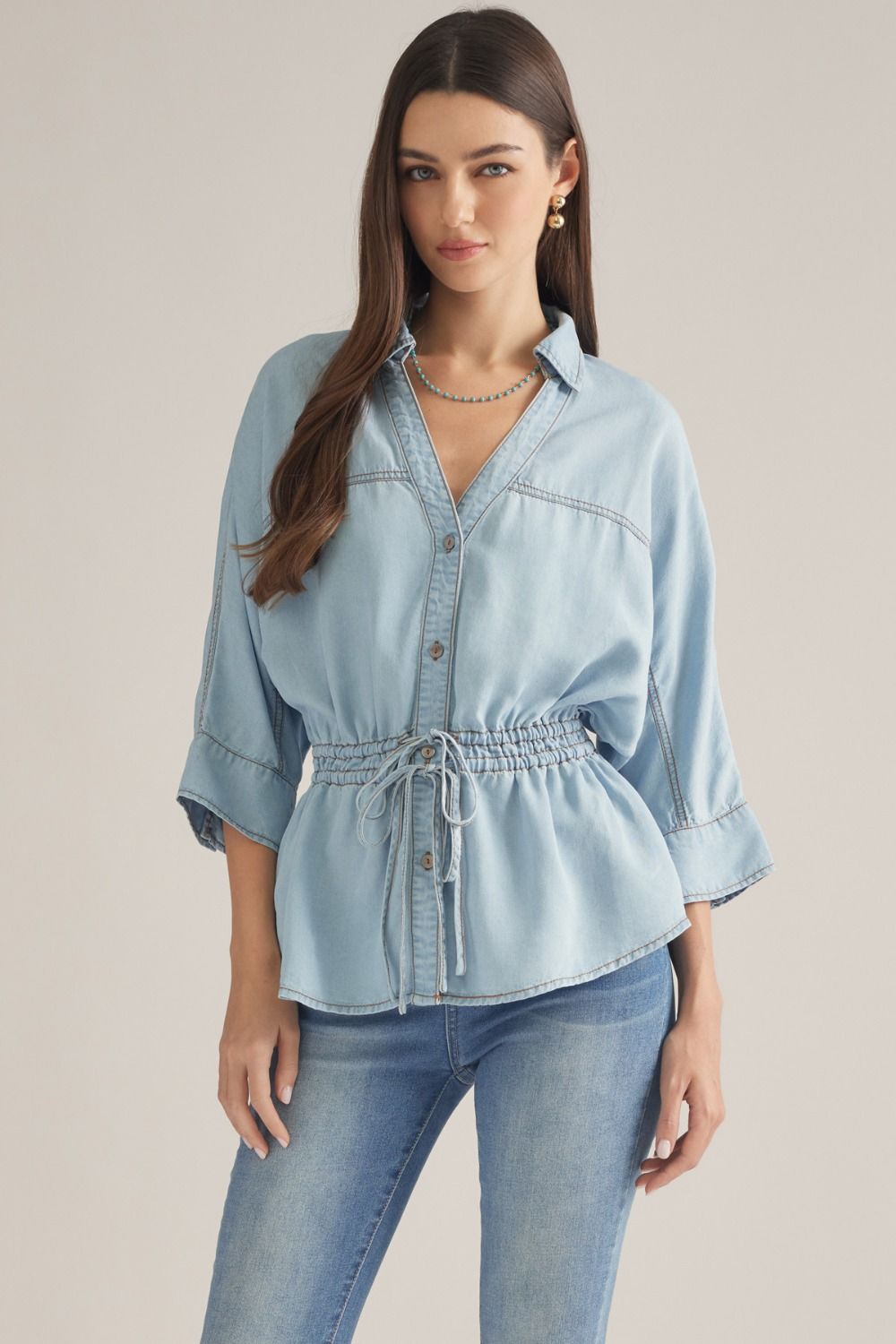 Solid ¾ sleeve top with a drawstring waist