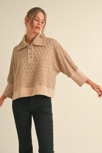 Textured pullover top with buttoned henley collared neck