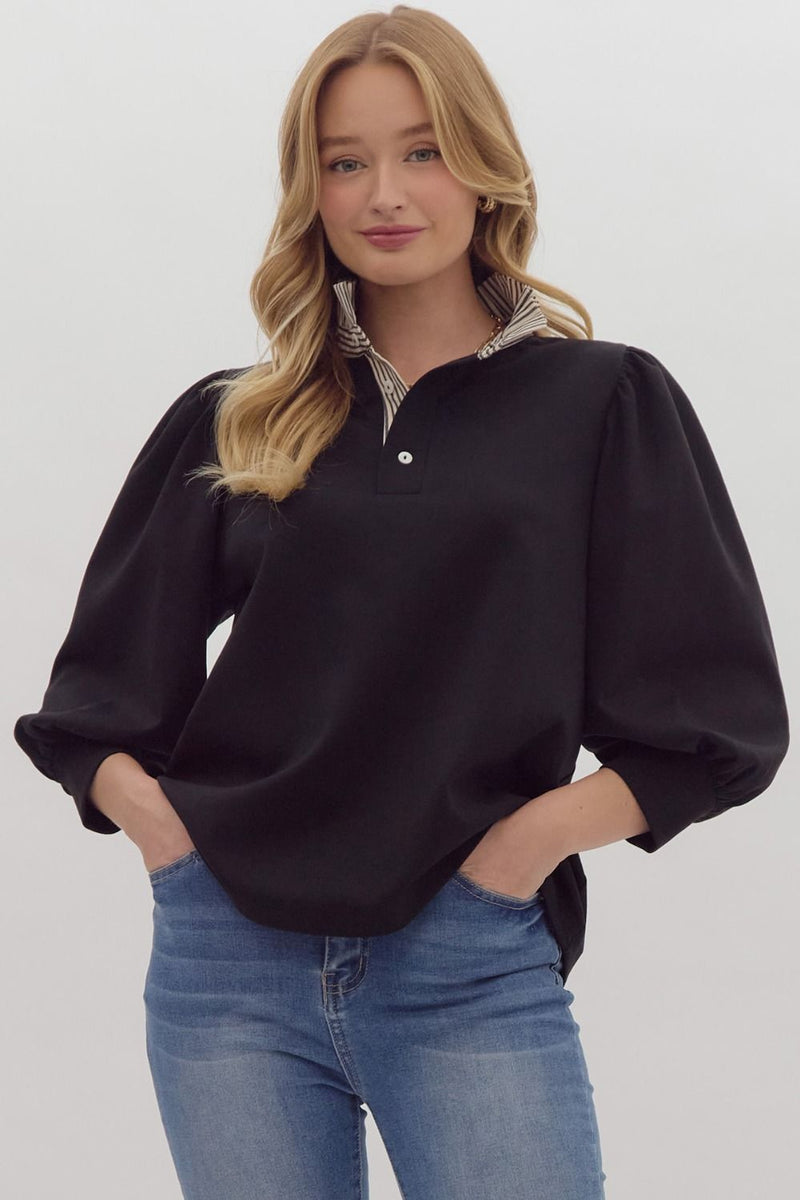 Solid ¾ balloon sleeve popover top featuring contrast ruffle neck