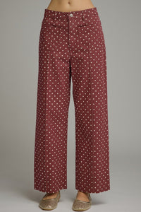 Polka dot pants featuring front and back pockets