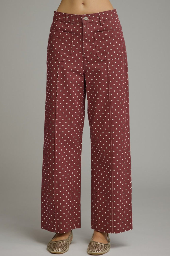Polka dot pants featuring front and back pockets