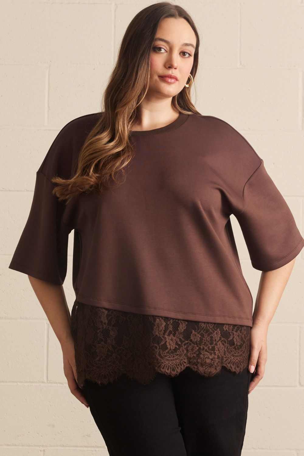 Solid short sleeve knit top featuring scallop lace hem detail