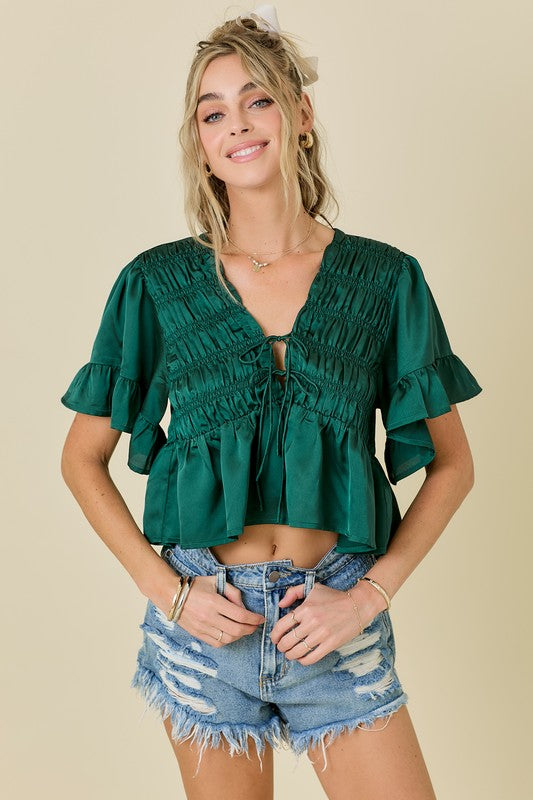 RUFFLE HEM SATIN TOP WITH SHIRRING AND TIE DETAILS