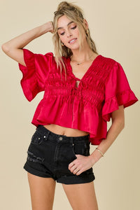 RUFFLE HEM SATIN TOP WITH SHIRRING AND TIE DETAILS