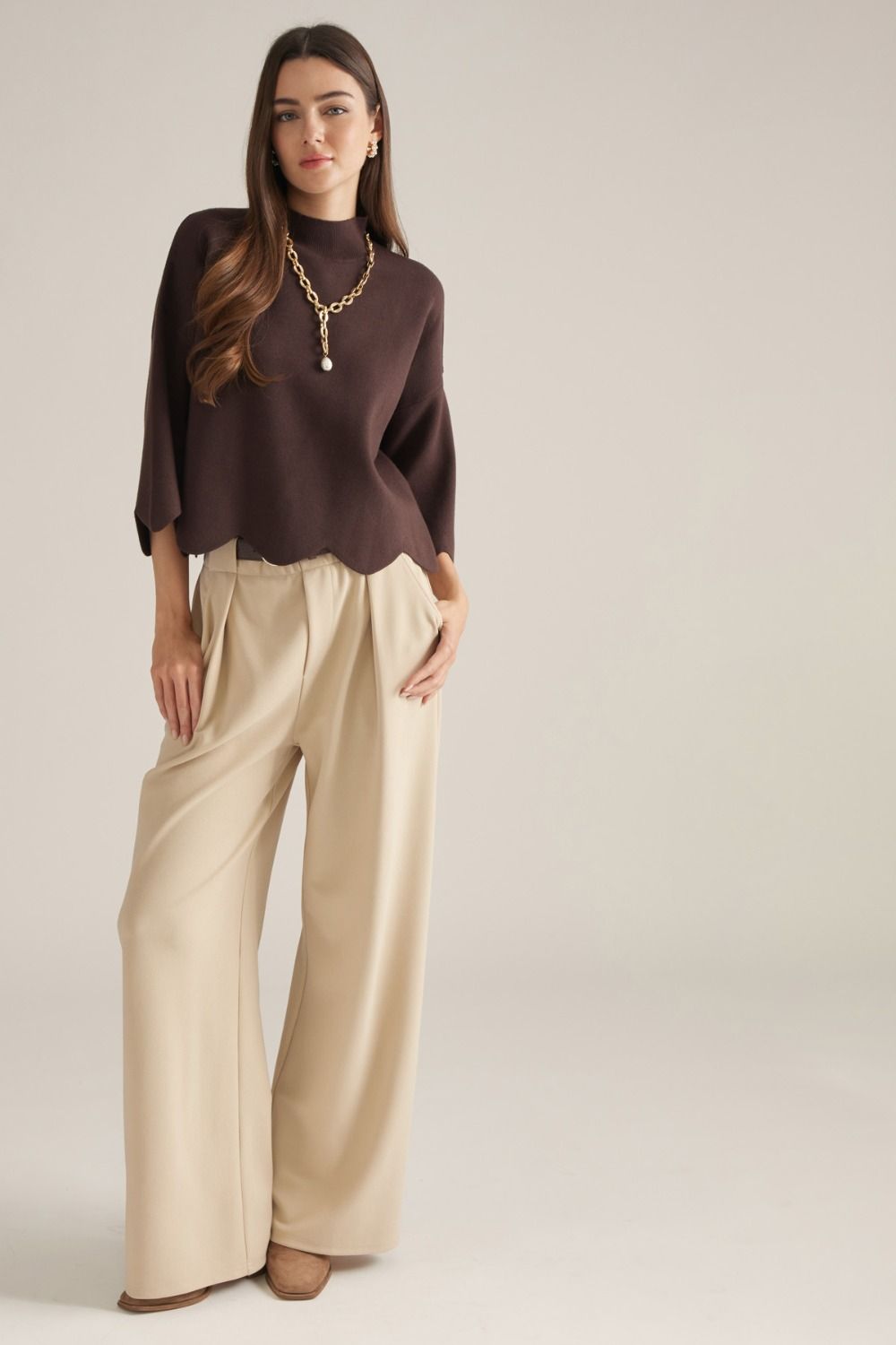 Solid ¾ sleeve sweater top with a mock nec