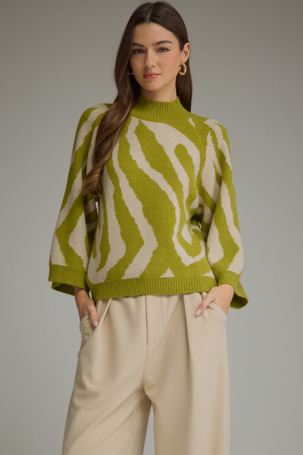 Abstract print ¾ sleeve sweater top with a mock neck