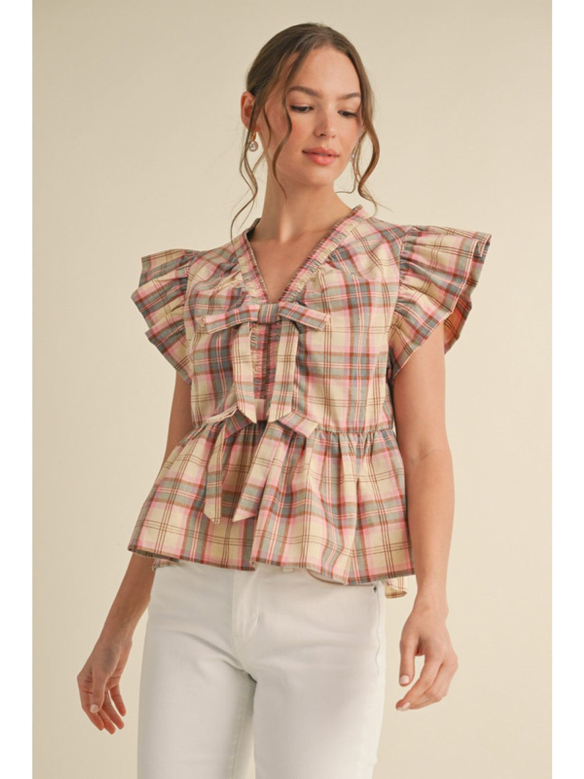 Plaid peplum top with smocked V-neck, front bow ties