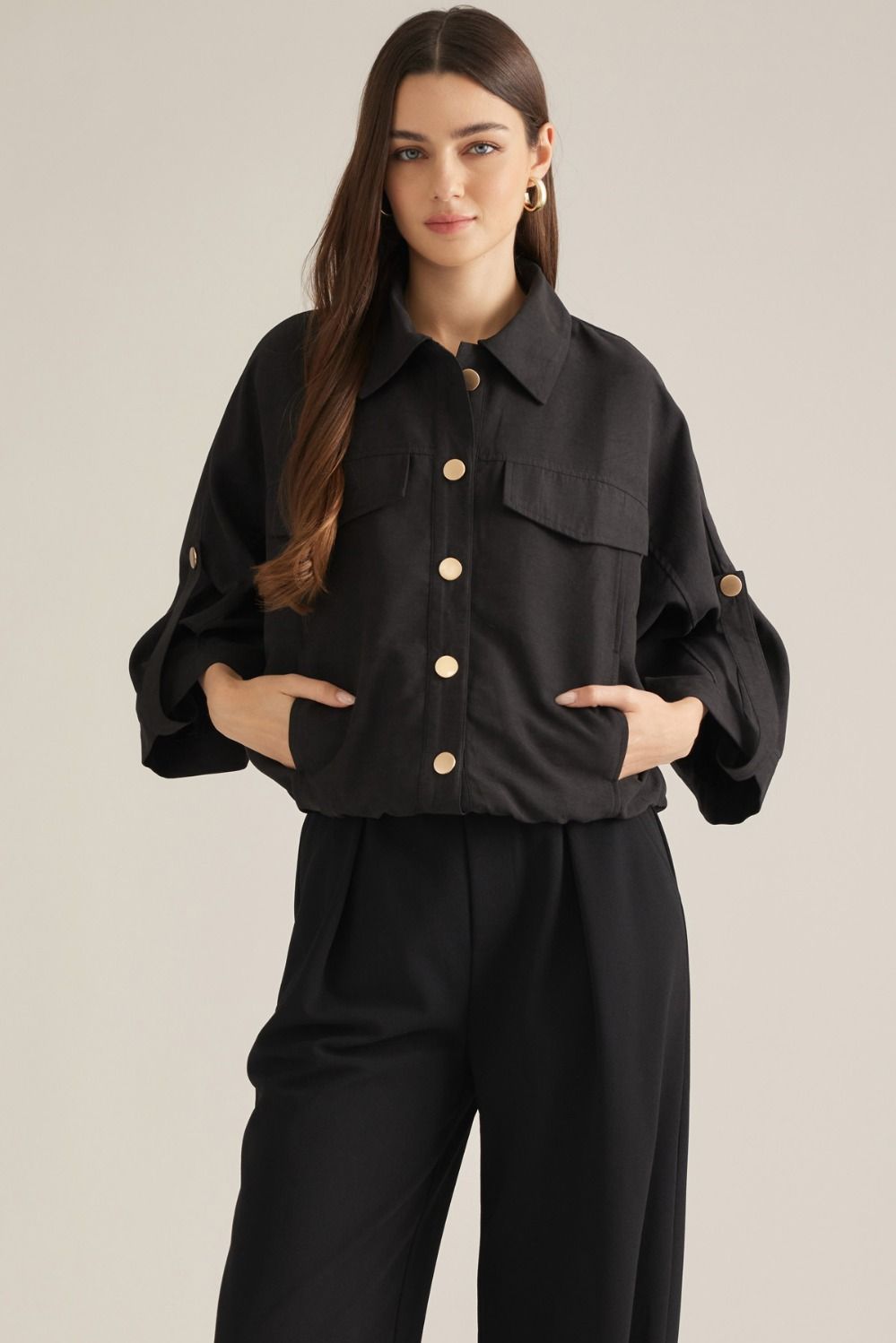 Solid ¾ sleeve top with a V-neckline.