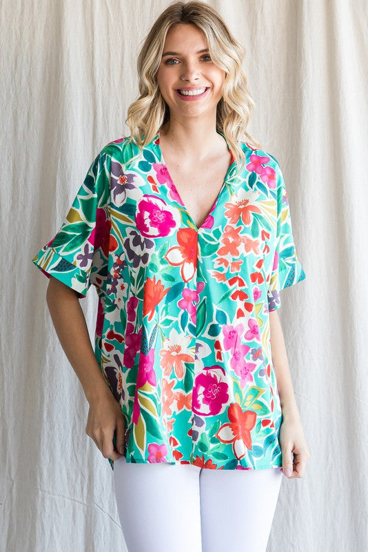 Plus Floral print top with a V-neck, cuffed short sleeves.