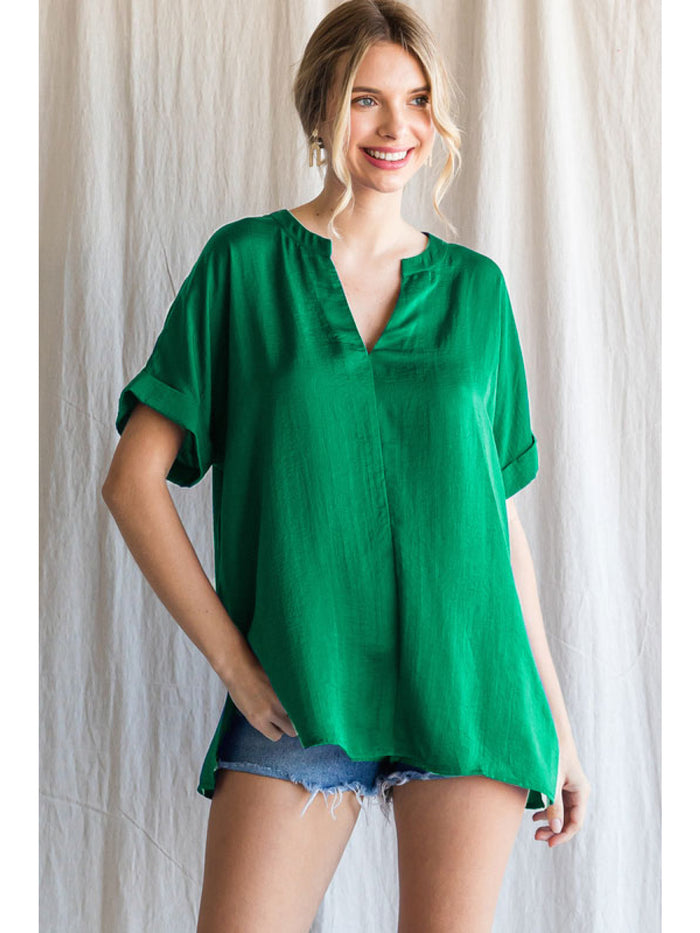 Solid top with a V-neck, cuffed short sleeves and side slit hemline.